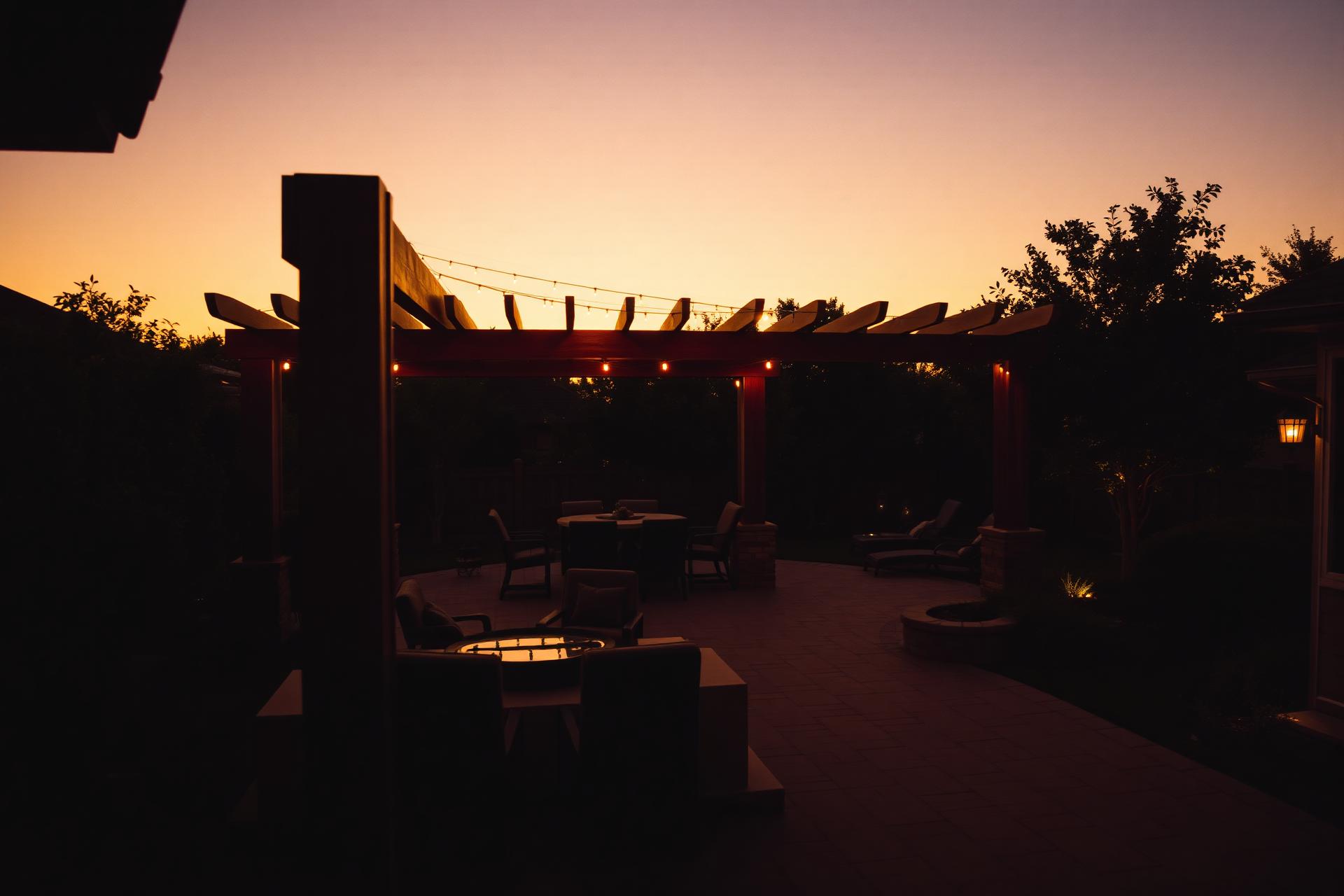 Custom pergola and patio at golden hour in a DFW backyard